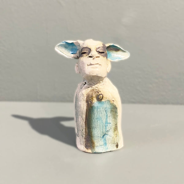 Miniature figure with large 'listening ears' loosely inspired by creation stories, from folklore by contemporary ceramicist Sharon Griffin