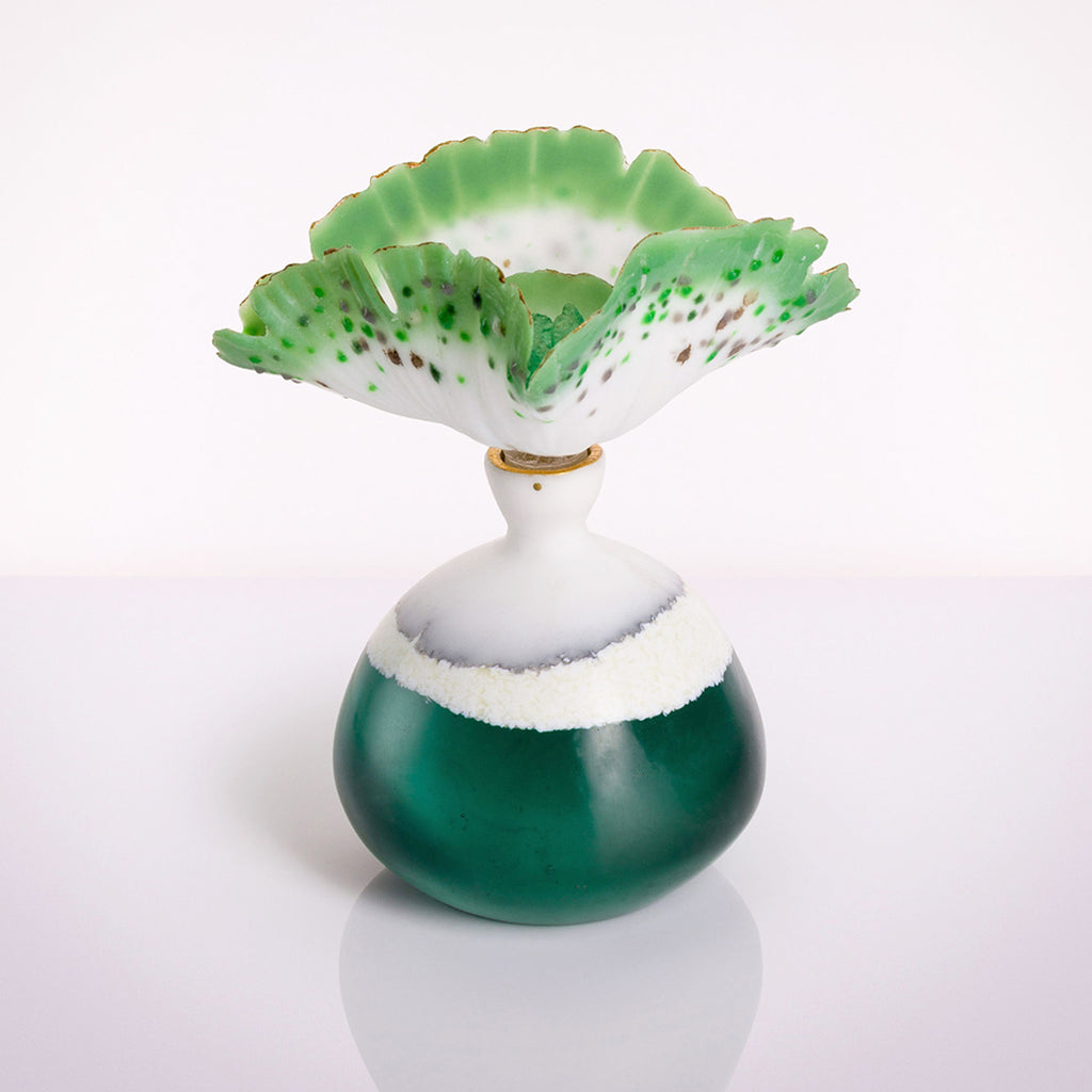 Aqua Mutalism Bottle made from cast glass and pate de verre by glass artist Verity Pulford part of the Bluecoat Display Centre Plant based exhibition
