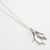 sterling silver pendant inspired by clusters of ash seeds, with leaf skeleton imprints on one side. Each key hangs separately so it has lovely movement.  photographed on an angle on white background