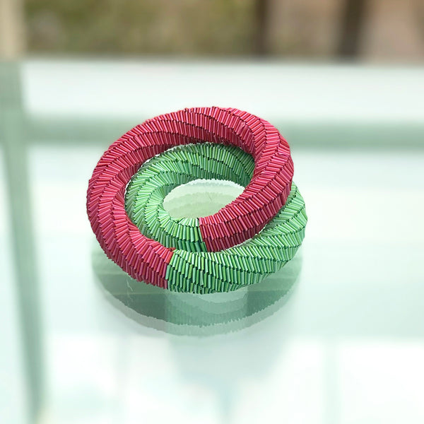 bracelet that also doubles as a necklace  made of pink and green paper by Rike Lenzing