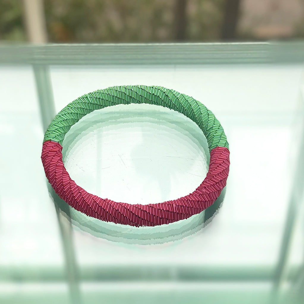 necklace that also doubles as a bracelet made of pink and green paper by Rike Lenzing