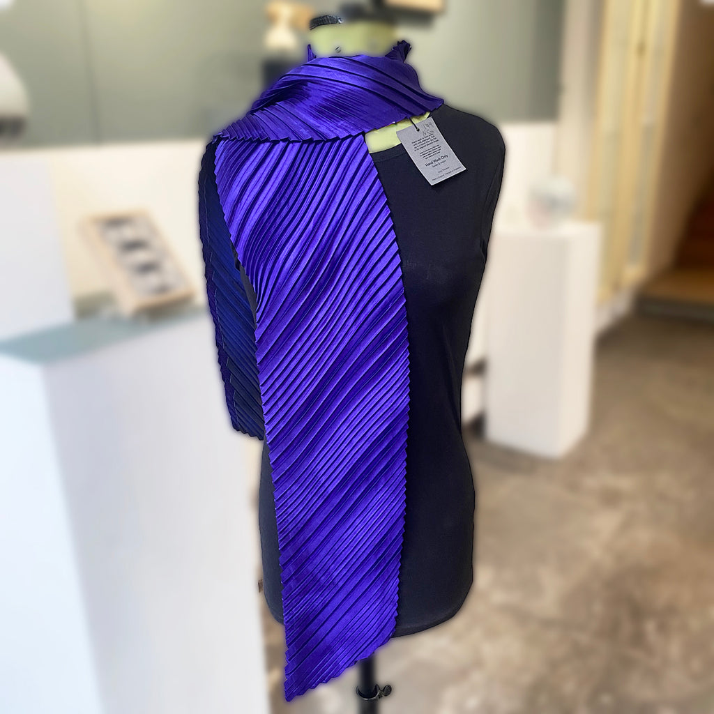 Mannequin wearing knotted statement noon  scarf in Purple/Indigo by Nawal Gebreel at the Bluecoat Display Centre