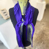 Mannequin wearing knotted statement noon scarf in Purple/Indigo by Nawal Gebreel phographed from above at the Bluecoat Display Centre