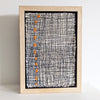 Framed textile art featuring a bold design comprised of orange dots in a stitched grid by Irish textile artist Patricia Kelly