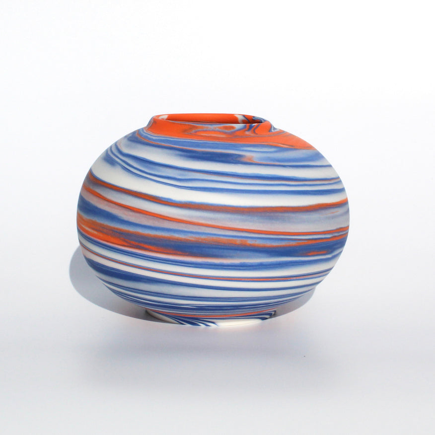 striking vase by contemporary ceramicist Corinne Price with a marbled abstract design using the clay as a vessel to create a bold design.