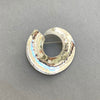 Beautiful Sterling Silver Swirled Round Brooch by irish Silversmith Kevin O’Dwyer on a grey background
