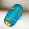 Base view of small cone vase from contemporary glass worker Will Shakspeare's 'Random Trails' range, inspired by walking in the Elan Valley in Wales.  This vase is predominently aqua blue with threads of gold colour