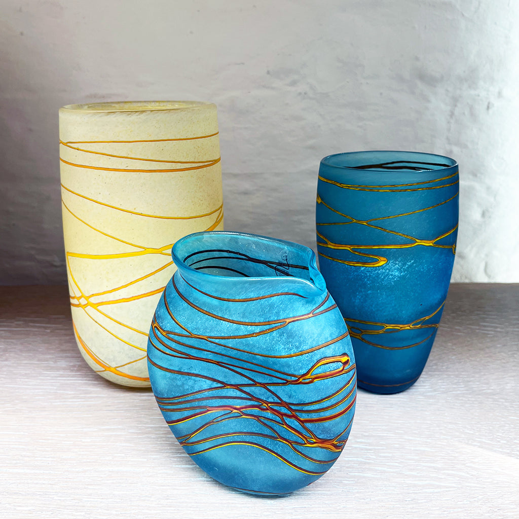 A collection of 3 vases from contemporary glass worker Will Shakspeare's 'Random Trails' range, inspired by walking in the Elan Valley in Wales