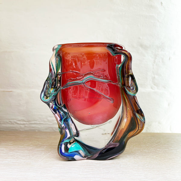 A stunning bowl by contemporary glass artist Will Shakspeare. The piece is inspired by trees and is predominantly red in colour with 'roots' in blues and a kaleidoscope of colours.