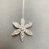 Close up of flower pendant by Irish Silversmith Kevin O’Dwyer in sterling silver