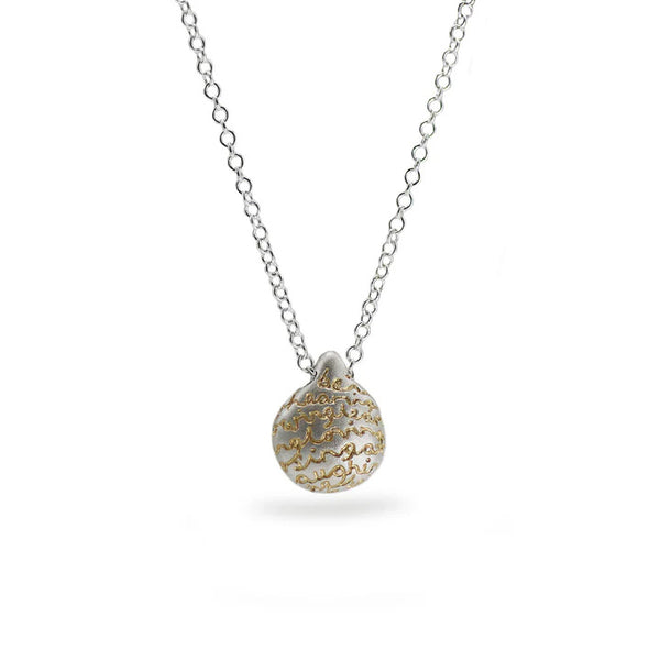 Silver pebble pendant with an organic finish and hand-etched words in gold by contemporary jeweller Diana Porter