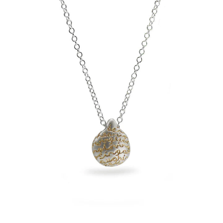 Silver pebble pendant with an organic finish and hand-etched words in gold by contemporary jeweller Diana Porter