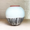 Close up of small round vase by Irish contemporary ceramicist Adam Frew 