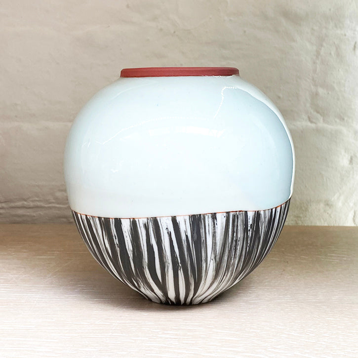 Close up of small round vase by Irish contemporary ceramicist Adam Frew 