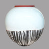 small round vase by Irish contemporary ceramicist Adam Frew with terracotta-coloured rim and painted black detailing on the bottom half 