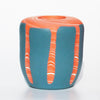 by Contemporary Irish Ceramicist Corinne Price a tangerine and blue nerikomi vase features a bright hand formed design; the coloured clay pattern acting as the main design feature of the vase. 