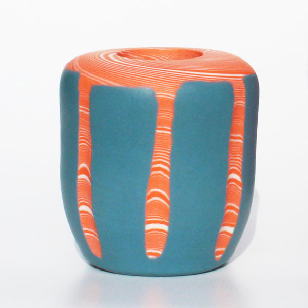 by Contemporary Irish Ceramicist Corinne Price a tangerine and blue nerikomi vase features a bright hand formed design; the coloured clay pattern acting as the main design feature of the vase. 