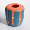 tangerine and blue nerikomi vase features a bright hand formed design; the coloured clay pattern acting as the main design feature of the vase by contemporary ceramicist Corinne Price
