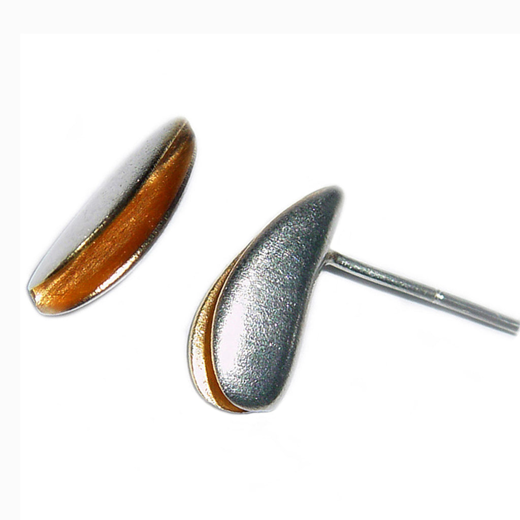 Pair of front split silver shell stud with a rich 22ct gold plated interior. These simple sterling silver earrings have a natural organic form. Shown on a white background from both front and side view
