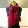star pleat printed scarf by Nawal Gebreel shown tied around a manequin
