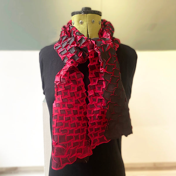star pleat printed scarf by Nawal Gebreel shown tied around a manequin
