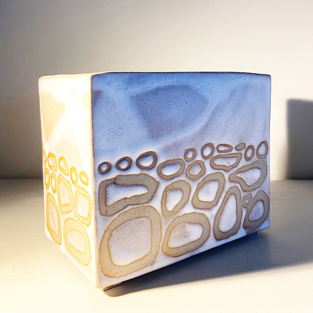 box vase in a buff stoneware clay, simply finished with a loosely applied off-white matte glaze by contemporary ceramicist Sarah Bartlem