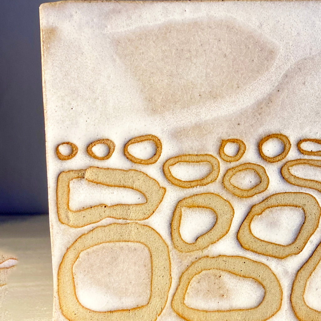 Detail close up of box vase in a buff stoneware clay, simply finished with a loosely applied off-white matte glaze by contemporary ceramicist Sarah Bartlem