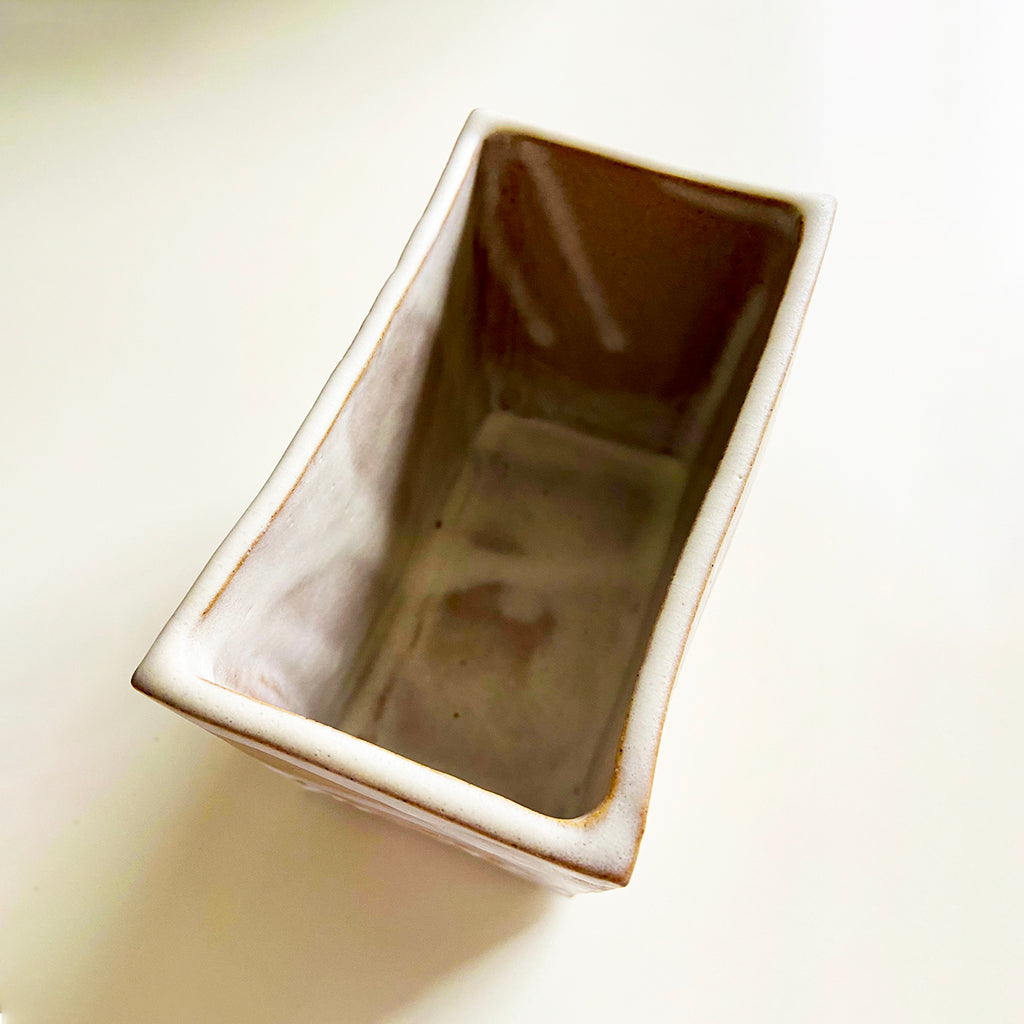 top inside view of box vase in a buff stoneware clay, simply finished with a loosely applied off-white matte glaze by contemporary ceramicist Sarah Bartlem
