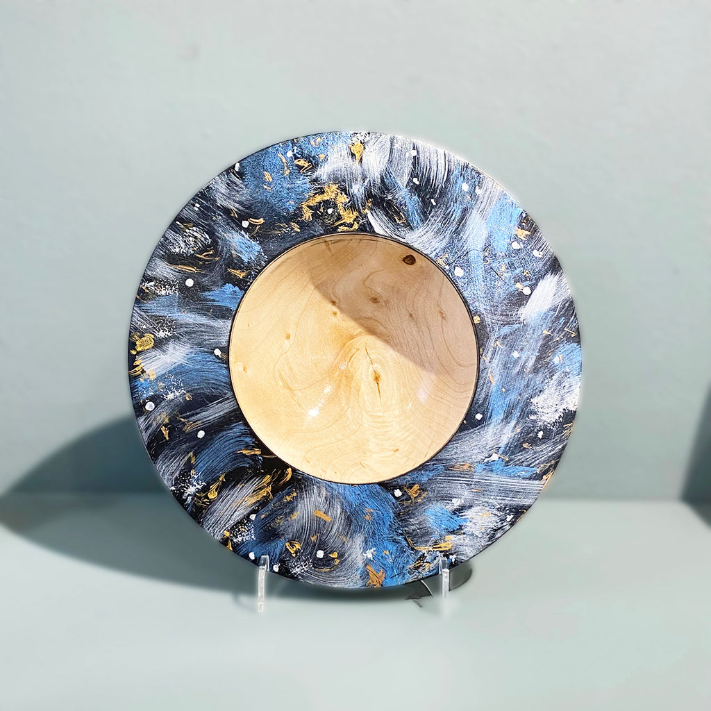 Decorative bowl with blue and gold abstract design. Turned Sycamore  hand painted using acrylic to resemble a celestial scene, then coated with a lacquer finish and polished by Bernie Yates