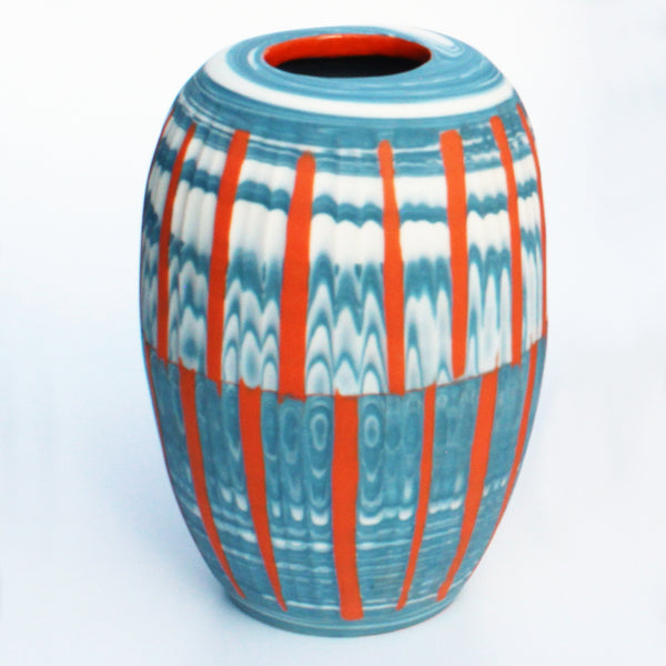 hand carved Tangerine and Blue Nerikomi vase by contemporary ceramicist Corinne Price with a bold design, working with the clay to produce an abstract design.