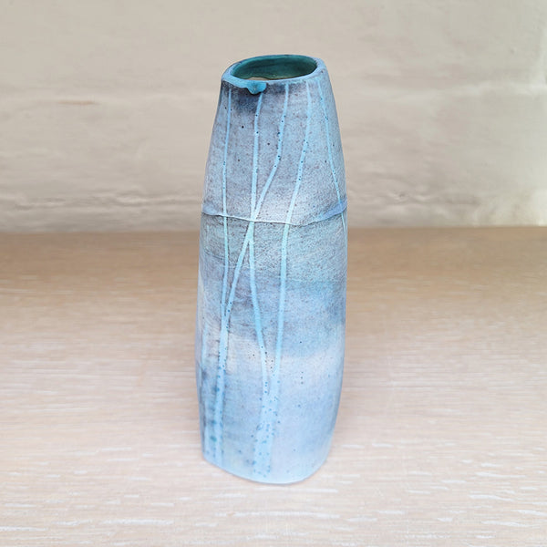 Hand built stoneware vase, great for a small posy of flowers. The woodland design is based on winter trees and features blues
