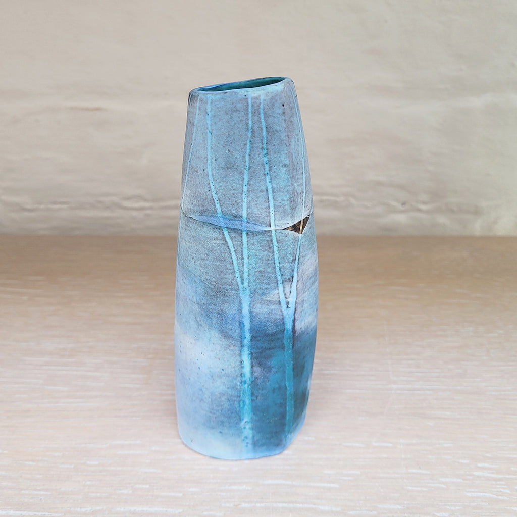 back view of Hand built stoneware vase by contemporary ceramicist Kirsti Hannah Brown - great for a small posy of flowers. The woodland design is based on winter trees and features blues