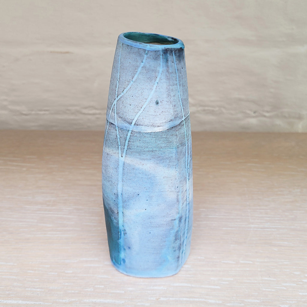 Side view of Hand built stoneware vase by contemporary ceramicist Kirsti Hannah Brown - great for a small posy of flowers. The woodland design is based on winter trees and features blues