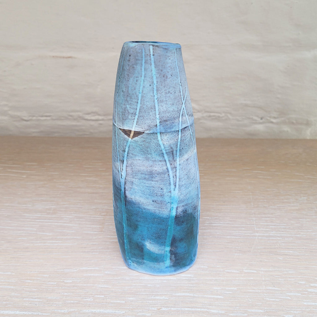 alternative side view of Hand built stoneware vase by contemporary ceramicist Kirsti Hannah Brown - great for a small posy of flowers. The woodland design is based on winter trees and features blues