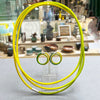 Double Loop Lemon & Lime earstuds by Gilly Langton in silver and hand dyed elastic shown with co-ordinating String necklace by the same artist photographed at the Bluecoat Dispay Centre