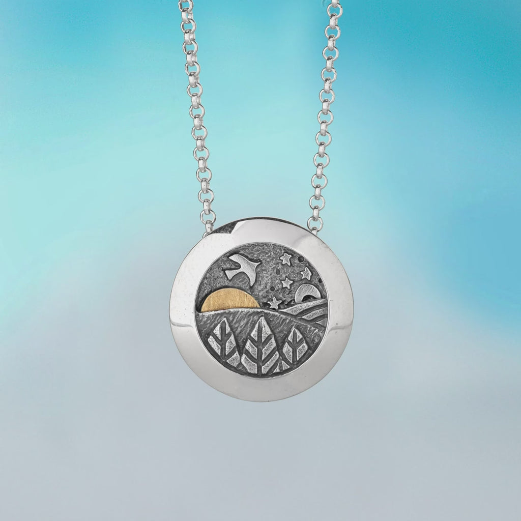 video of kinetic pendant by Alan Ardiff contemporary Irish jewellery - made of silver with an 18kt Gold sun, the design features a rising and setting sun to appreciate the rolling landscape of a beautiful day