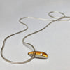 Necklace with silver shell pendant with 2pt diamond and a rich gold plated interior pendant 