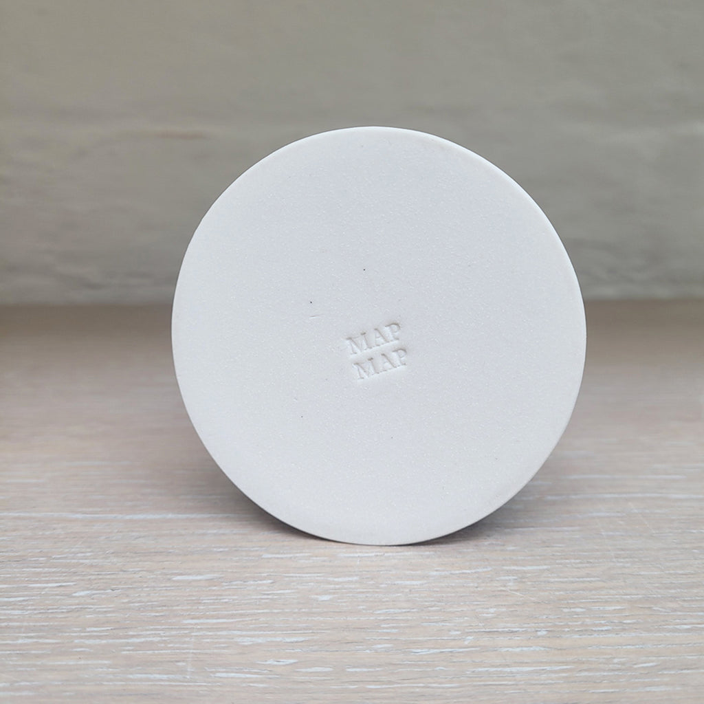 Slab-built porcelain ceramic cone bottle by MAP MAP showing makers mark on the base