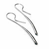 Side view of Silver dangle earrings with blue topaz gemstones by contemporary jeweller Paul Finch