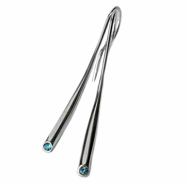 Silver dangle earrings with blue topaz gemstones by contemporary jeweller Paul Finch

